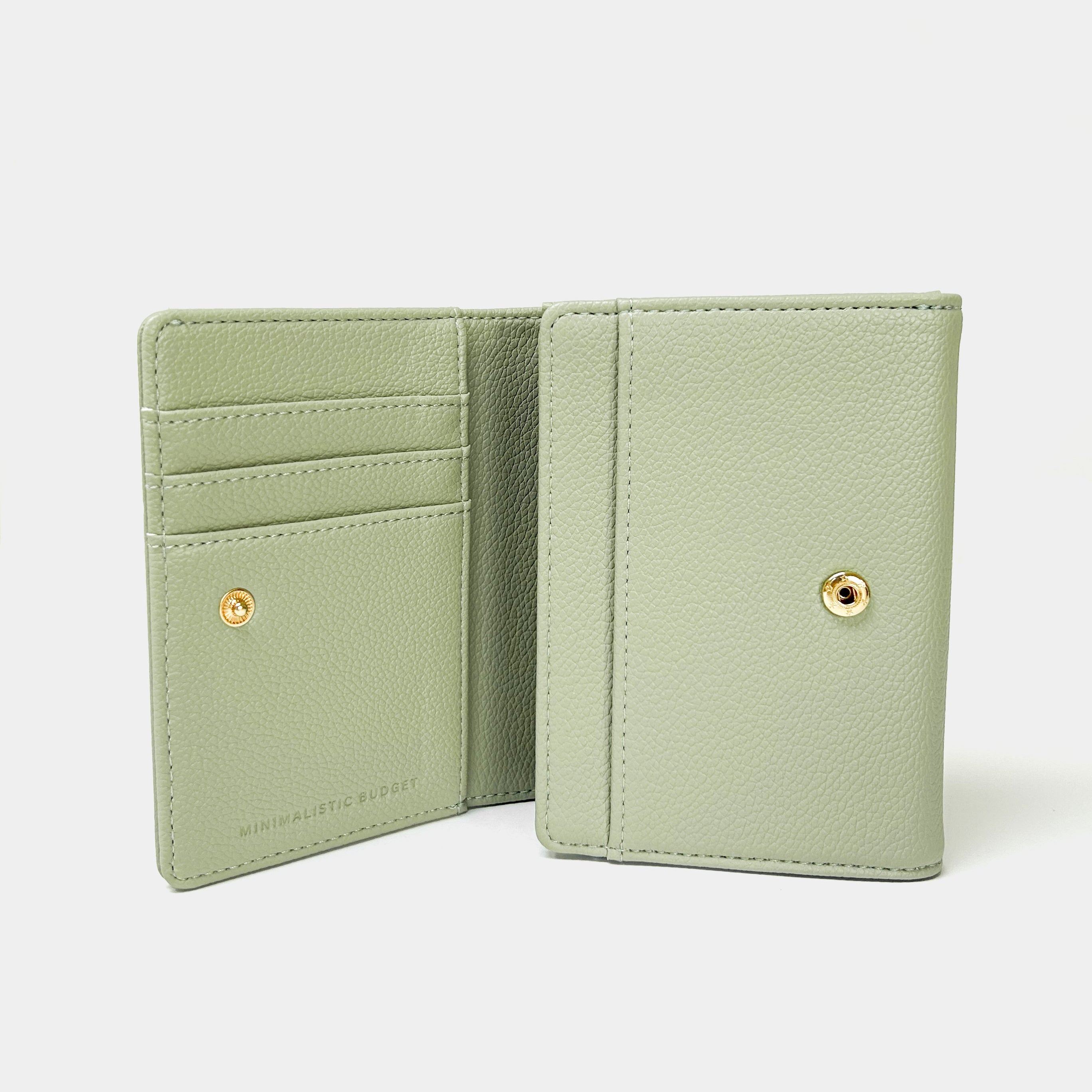 Green wallet open on a white background