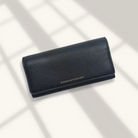 Black leather wallet on a light background