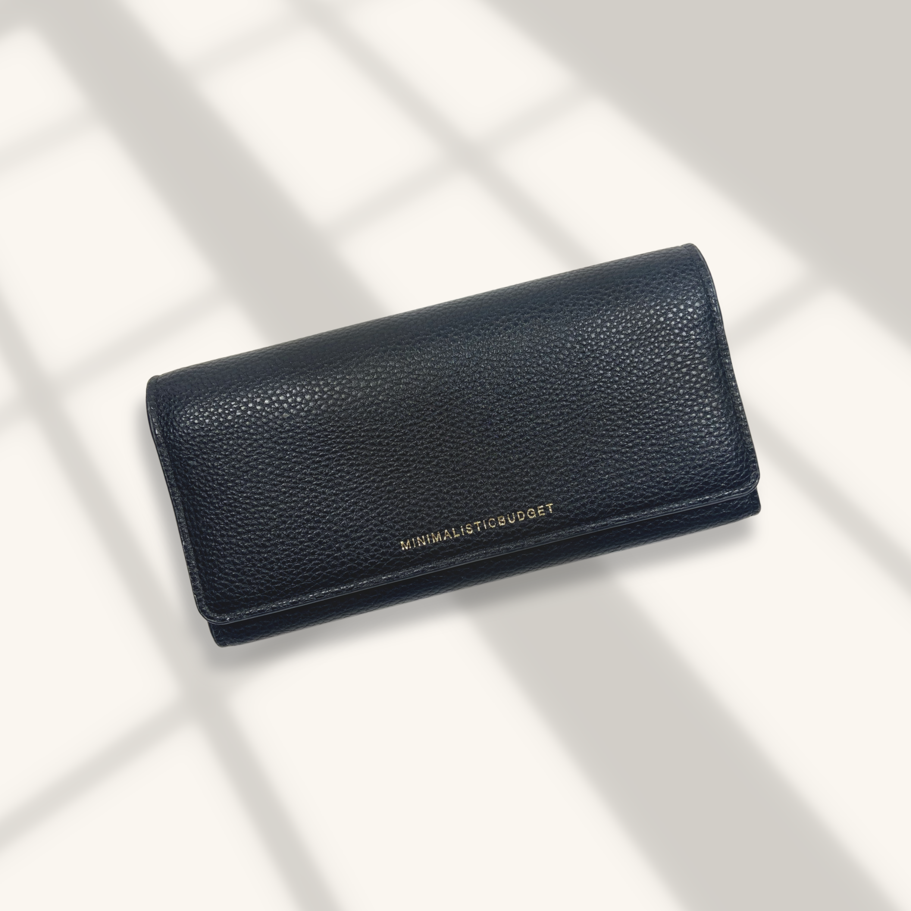 Black leather wallet on a light background